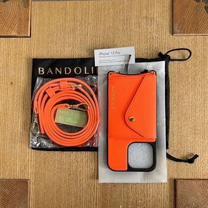 Bandolier Donna Side Slot Crossbody iPhone 13 Pro Case  - Neon Orange / Gold NWT